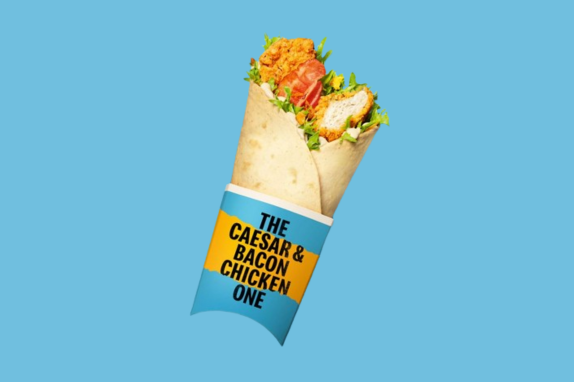 Caesar Bacon and chicken Wrap on blue background