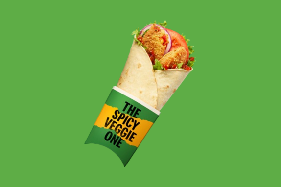 spicy veggie wrap on green background